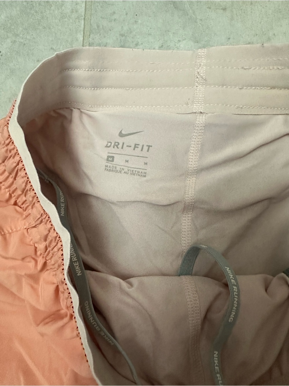 Nike Women’s medium Dri-FIT Running Shorts - Coral / Peach / pink - Picture 5 of 6